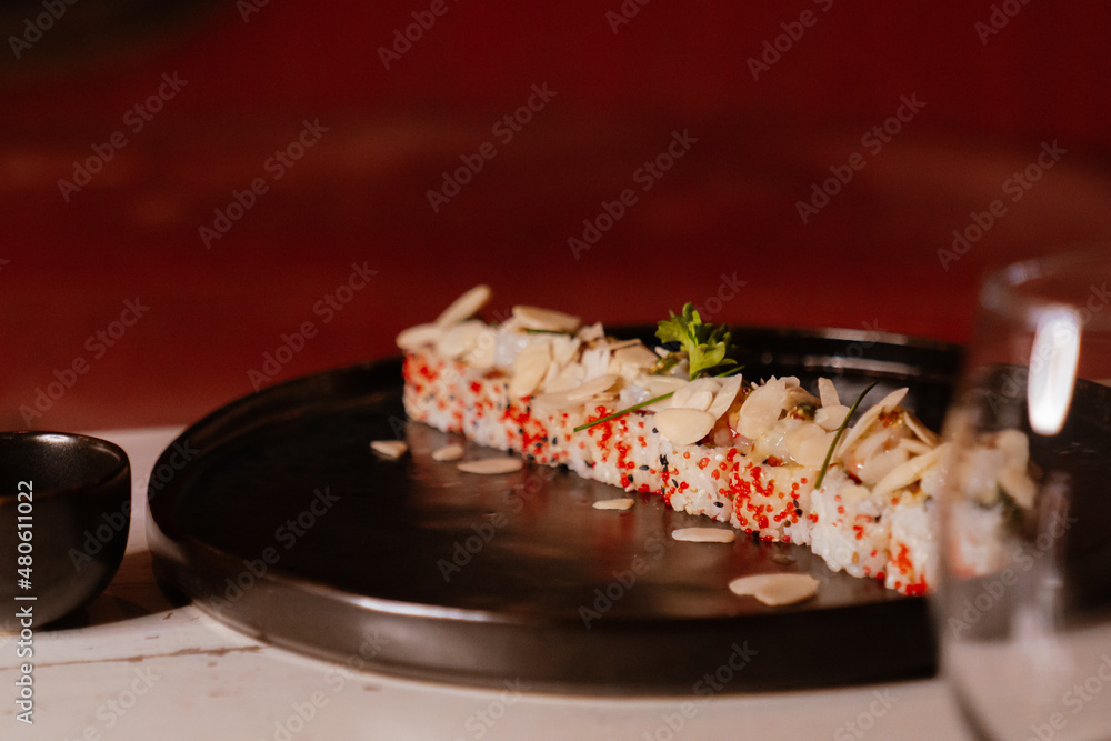 Flattings of Uramaki sushi on table
