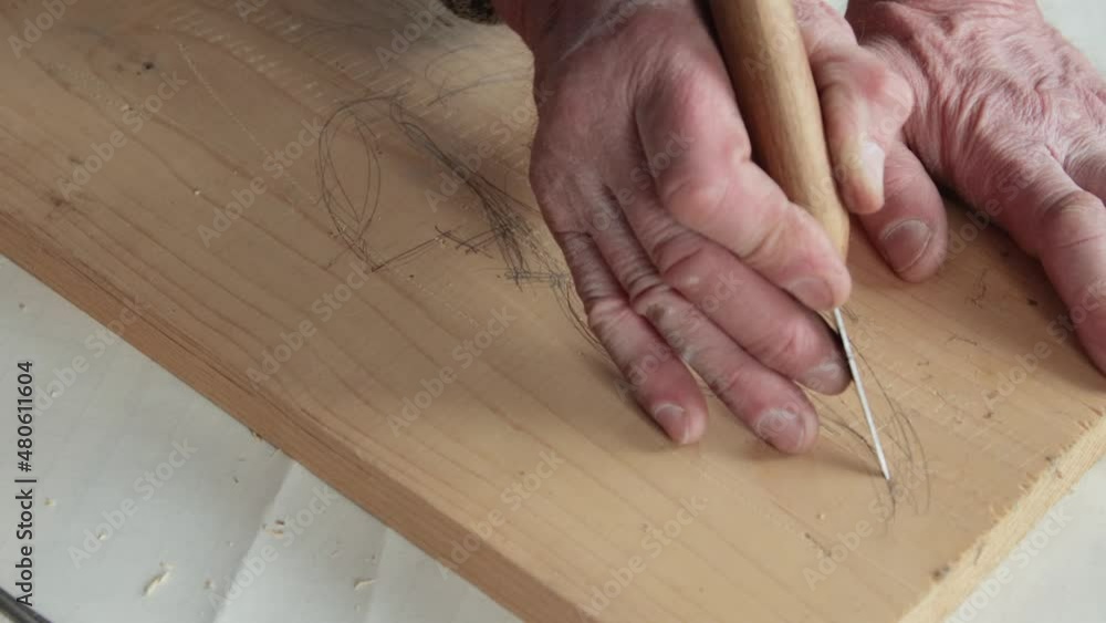 Closeup shoot of a woodcarver at work Closeup shoot of a woodcarver at work