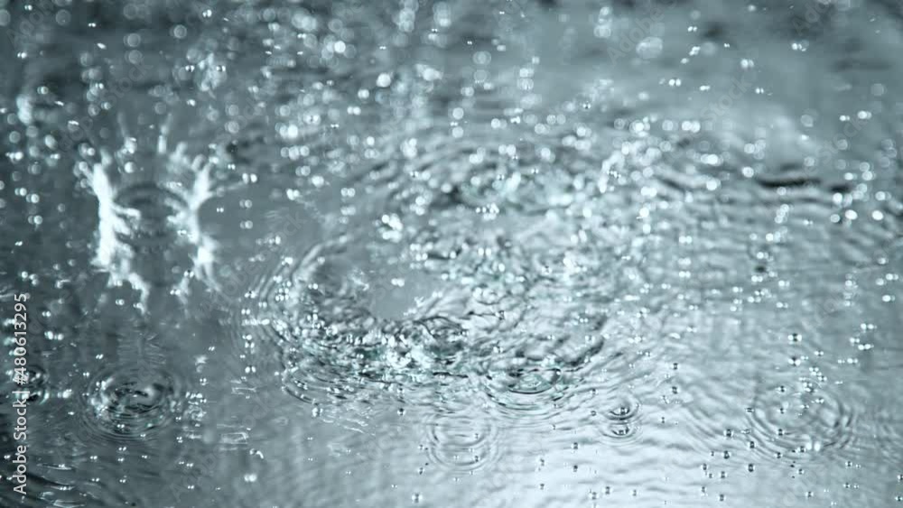 Super Slow Motion Shot of Many Water Drops Falling and Splashing on Surface at 1000fps. Super Slow Motion Shot of Many Water Drops Falling and Splashing on Surface at 1000fps.