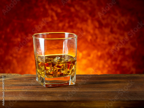 whiskey on the rocks on a wooden table