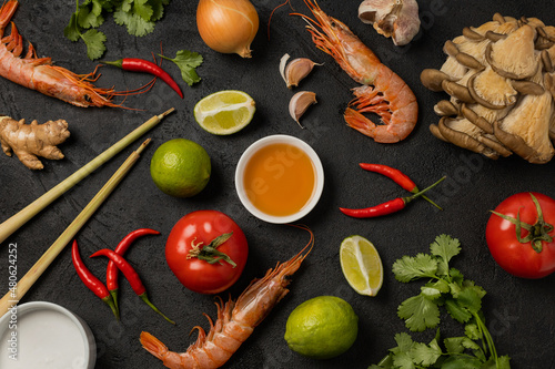 Pattern of ingredients for tom yum soup on a black background