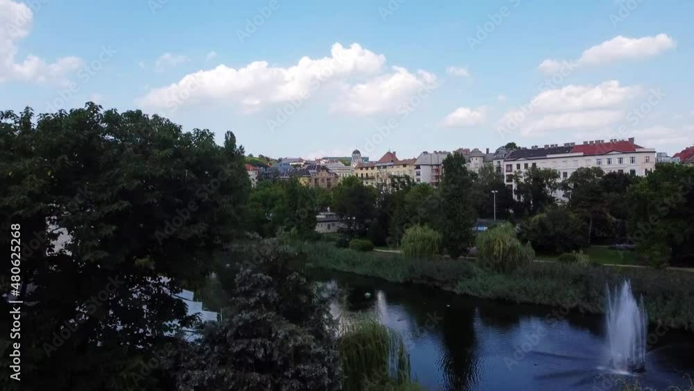 View of houses in Bartok area in Budapest. Park with a lake. Drone Video. Hungary. Europe View of houses in Bartok area in Budapest. Park with a lake. Drone Video. Hungary. Europe