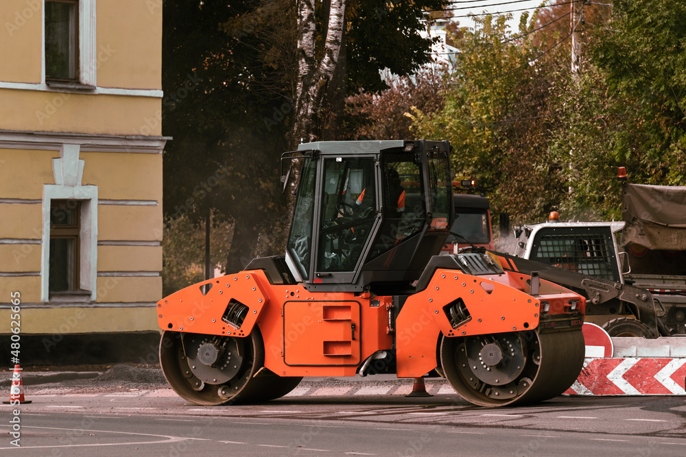 Roller for laying asphalt on the road. Road repair equipment.