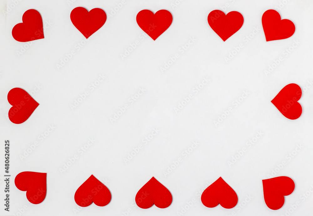 frame with red hearts on a white background with place for text, top view, Valentine's Day is the holiday of lovers. frame with red hearts on a white background with place for text, top view, Valentine's Day is the holiday of lovers.