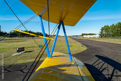 The runway viewed through the wings of a biplane at the airport in Florence, Oregon, USA