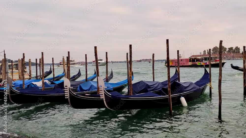 Gondolas on a quay on Grande canale, Venice Gondolas on a quay on Grande canale, Venice