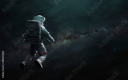 Astronaut at spacewalk looks at Milky Way. Elements of image provided by Nasa