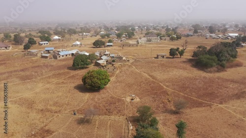 Aerial Bolgatanga Ghana rural bush savanna drought part 1. Bolga is the crafts center of Upper Region of Ghana. Dry savannah landscape. Scattered homes and villages. Historical border of Burkina Faso.