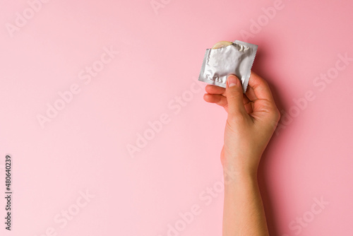 Tableau sur toile Woman using a condom for safe sex