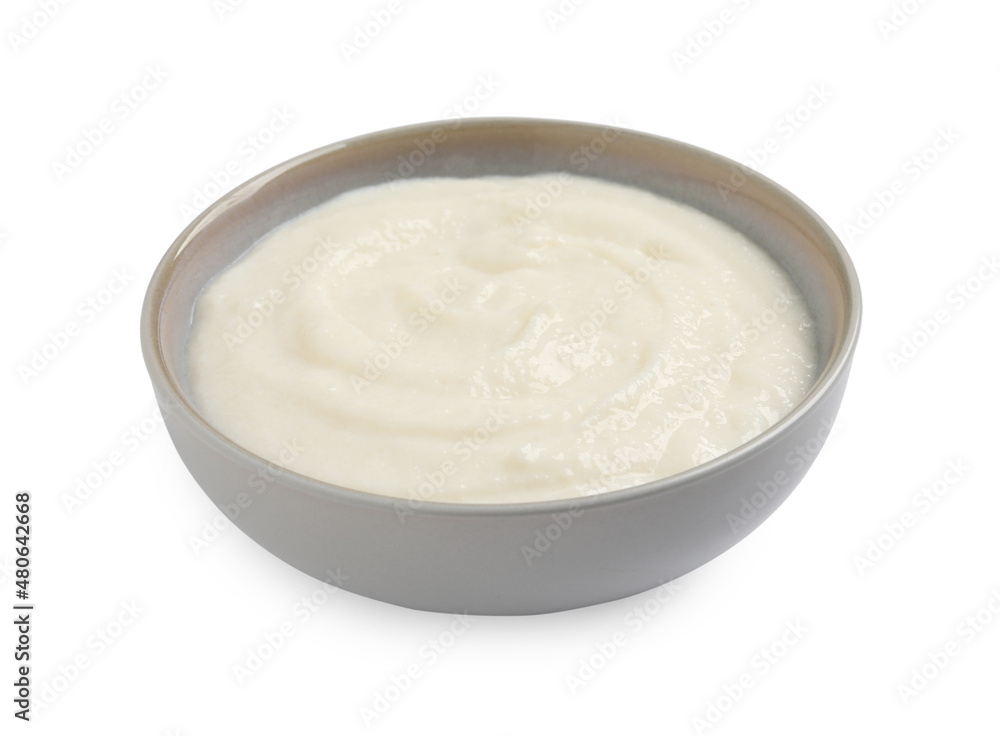 Bowl with delicious semolina pudding isolated on white Bowl with delicious semolina pudding isolated on white