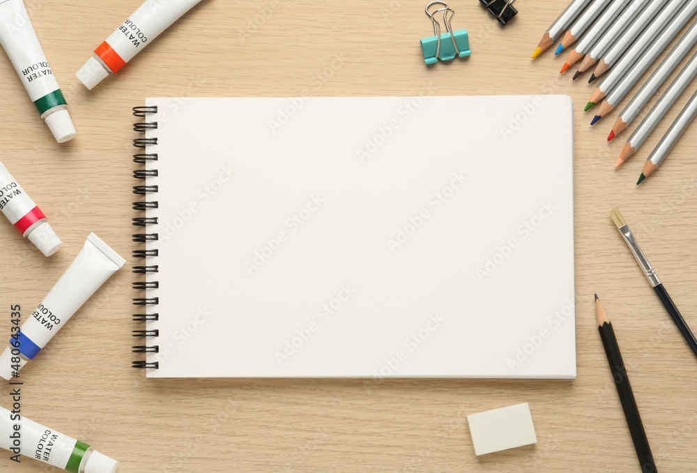 Blank Sketchbook On Wooden Table With Crayons Stock Photo