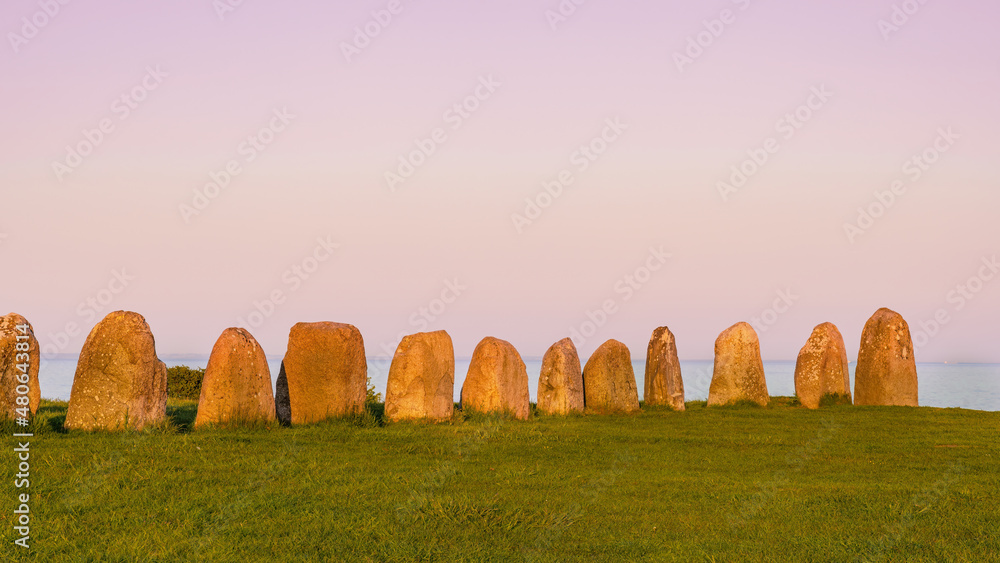 Ale Stones (Ales stenar) Is a megalithic monument of 59 large boulders and is 67 meters long. This landmark is located in Kåseberga, Sweden. Blurred background. 