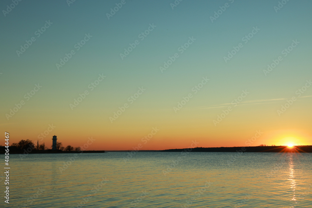 Picturesque view of beautiful sunset over calm river
