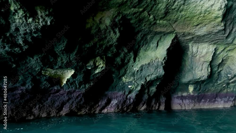 View looking around beautiful multi colour under water sea cave natural rock formation in Albufeira, Portugal