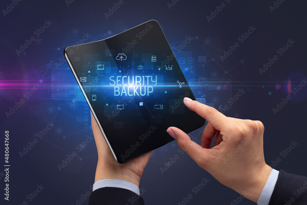 Businessman holding a foldable smartphone, security concept Businessman holding a foldable smartphone, security concept