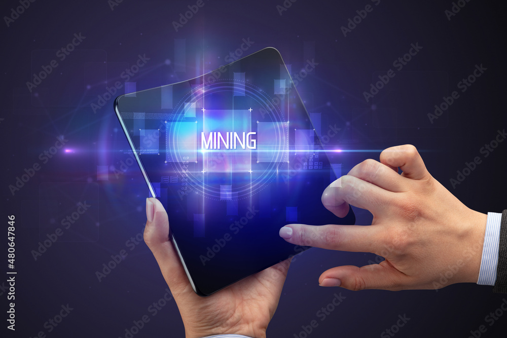 Businessman holding a foldable smartphone Businessman holding a foldable smartphone