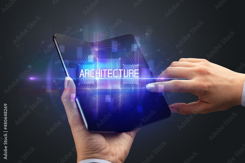 Businessman holding a foldable smartphone Businessman holding a foldable smartphone