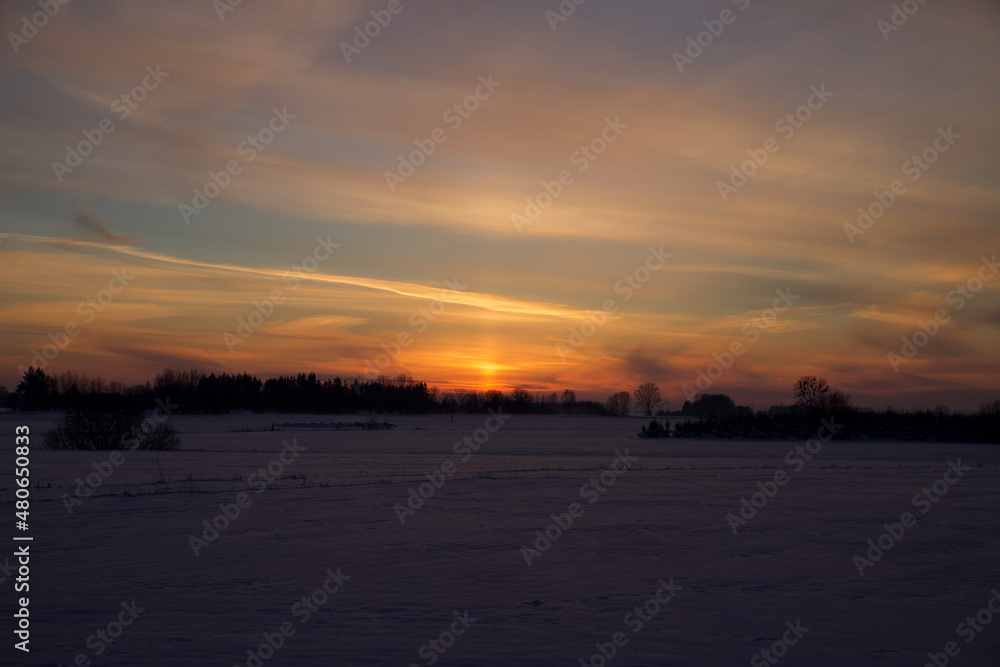 Colorful sky at sunset time with winter scenery. Colorful sky at sunset time with winter scenery.