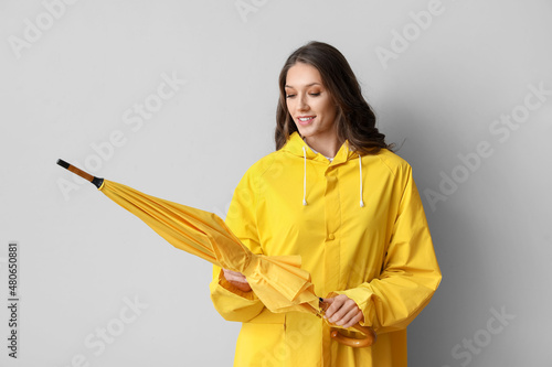 Beautiful woman in raincoat...