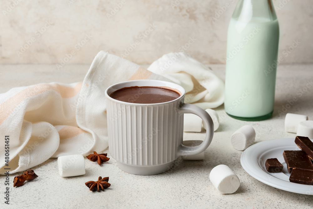 Cup of natural hot chocolate with marshmallows on light background Cup of natural hot chocolate with marshmallows on light background