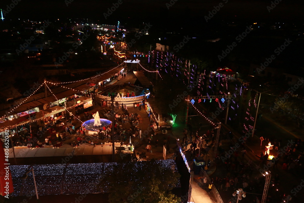 aerial view on the ferris wheel over the fair at night
