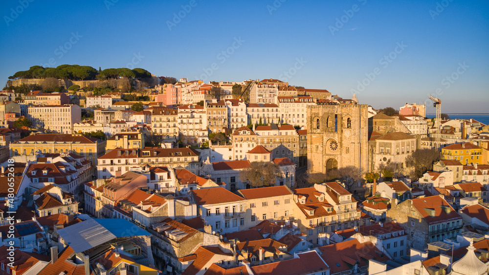 Aerial view of Cathedral of Lisbon (Sé de Lisboa). Sao Jorge Castle in the background. Winter Sunset