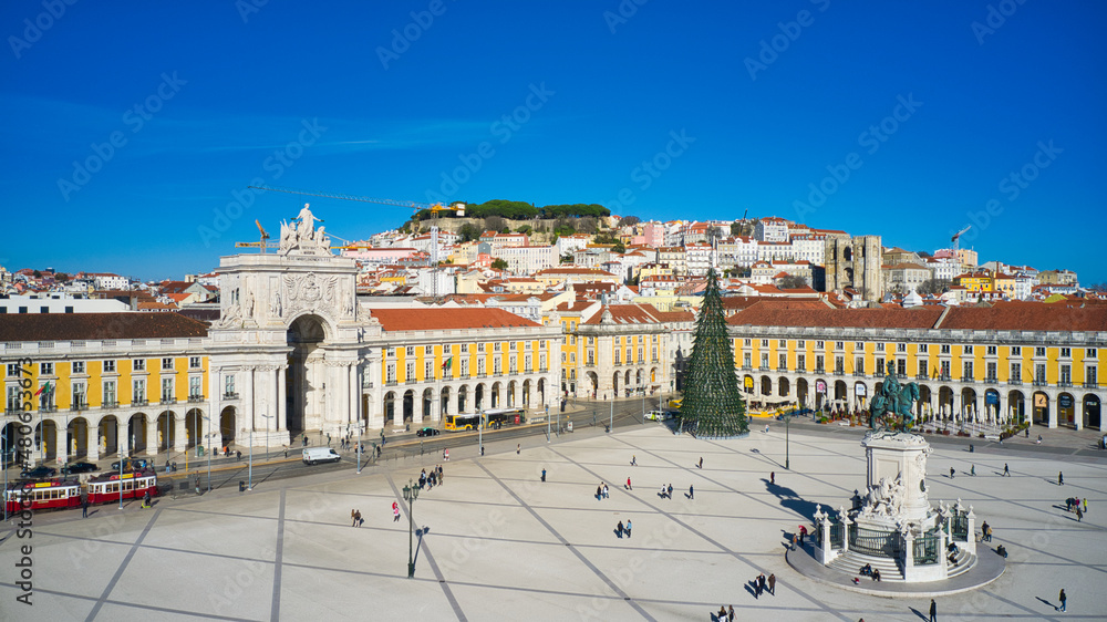 Lisbon, Portugal - January 13, 2022: Aerial drone view of the Augusta Street Arch from Commerce Square in Lisbon, Portugal. Christmas tree in the plaza.