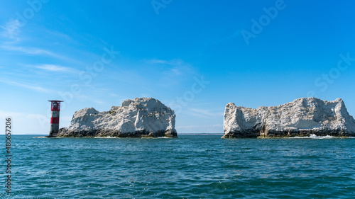 View of The Needles Lighthouse and chalk rocks in Alum Bay, Isle of Wight, United Kingdom photo