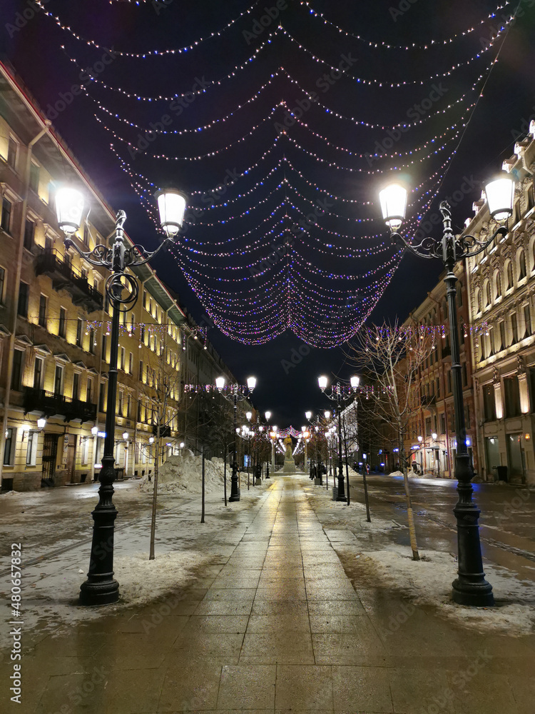 Festive illumination for Christmas and New Year on Malaya Konyushennaya Street in St. Petersburg on an early winter morning