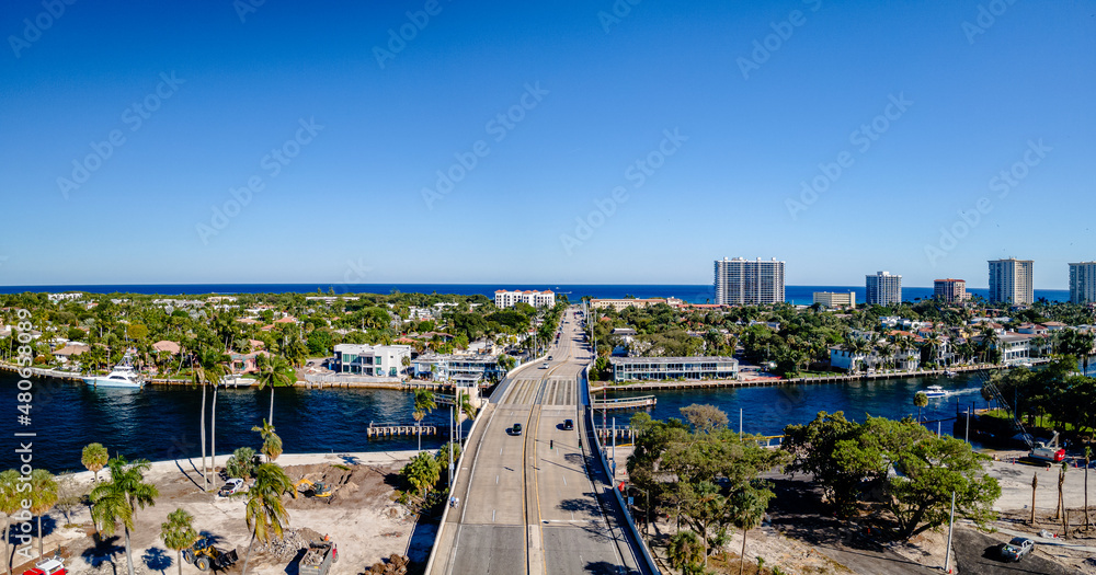 panoramic aerial drone view of bridge and city in Boca Raton, Florida with traffic 
