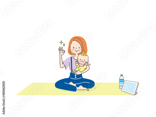 ヨガマットに座る若い女性と赤ちゃん