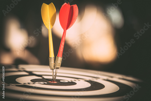 Bullseye target goal or dartboard has dart arrow throw hitting center shooting for financial business targeting planning to winner concept.