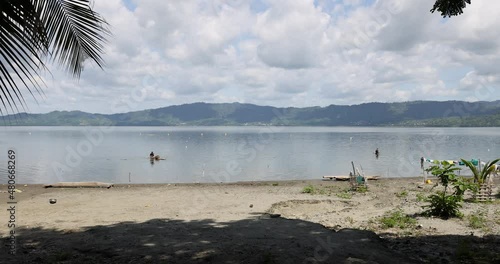 Lake Bosomtwe Fishing village Ghana Africa. Only natural lake in Ghana. It is situated within an ancient impact crater. A sacred lake in traditional beliefs. Tourist resorts and fishing industries. photo