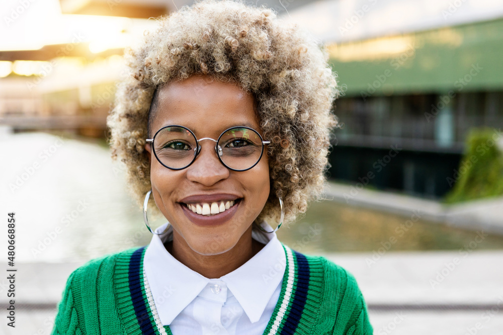 © Xavier Lorenzo - Portrait of young hispanic latin woman with afro hairstyle looking at camera outdoors - Ethnicity and millennial people concept © Xavier Lorenzo - Portrait of young hispanic latin woman with afro hairstyle looking at camera outdoors - Ethnicity and millennial people concept