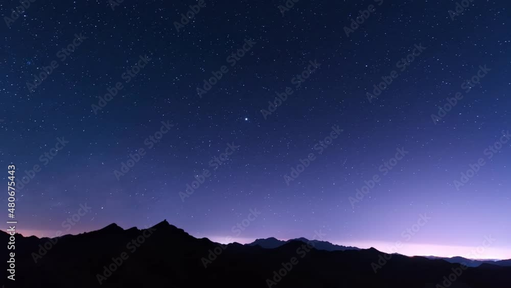 Time-lapse of dark blue starry night on the top of the mountain Time-lapse of dark blue starry night on the top of the mountain