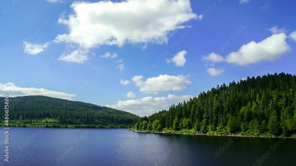 Time-lapse of river near the old bridge and clouds flowing in the sky in Heidelberg, Germany Time-lapse of river near the old bridge and clouds flowing in the sky in Heidelberg, Germany