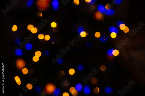 intentional soft focus or out of focus for special bokeh effect backdrop background or wallpaper for celebration of light circles overlapping and intersecting night time 