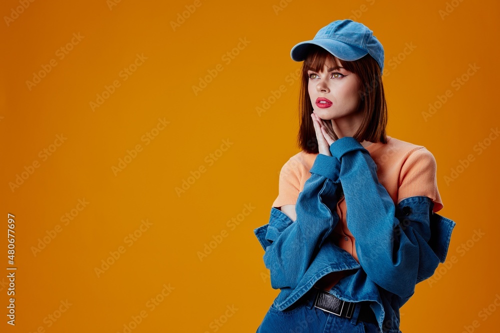 Portrait of a charming lady stylish denim clothing posing color background unaltered Portrait of a charming lady stylish denim clothing posing color background unaltered