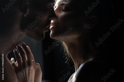 Close up face of a beautiful young couple in love embracing, romance and and affection. Sensual couple kiss. I love you. Romantic and love. photo