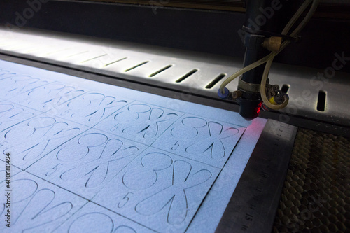 Laser cutting of felt fabric parts. Laser machine in production. photo