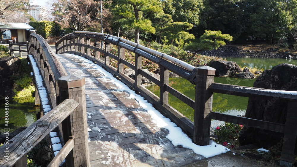 Japanese garden's bridge with snow
