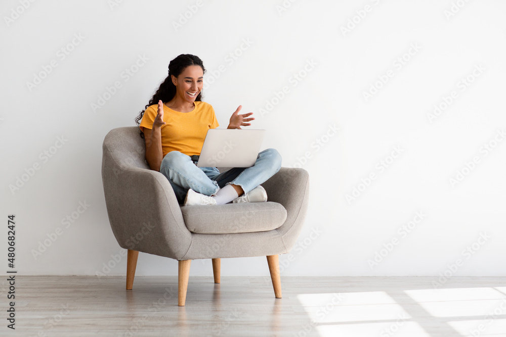 Portrait Of Joyful Young Female Making Video Call On Laptop At Home Portrait Of Joyful Young Female Making Video Call On Laptop At Home
