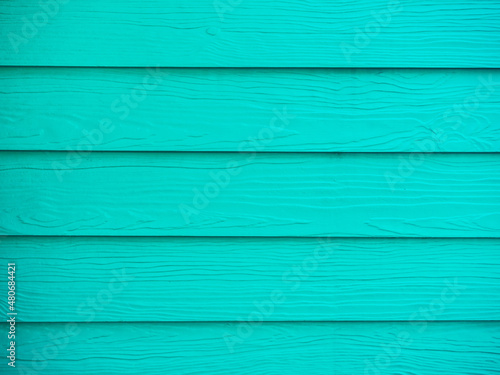 Light green, turquoise color wood texture, wall background surface with a horizontal pattern. Vintage green timber table top view.