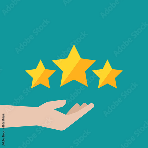 Hand with three golden stars. Giving rating. Ranking business or service. Feedback  reputation and quality assessment