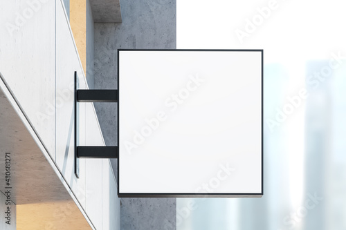 Building exterior with signboard banner for product placement on the streets in business area. Mock up