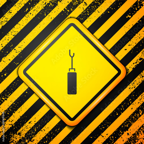 Black Awl tool with wooden handle icon isolated on yellow background. Work equipment tailor industry. Warning sign. Vector