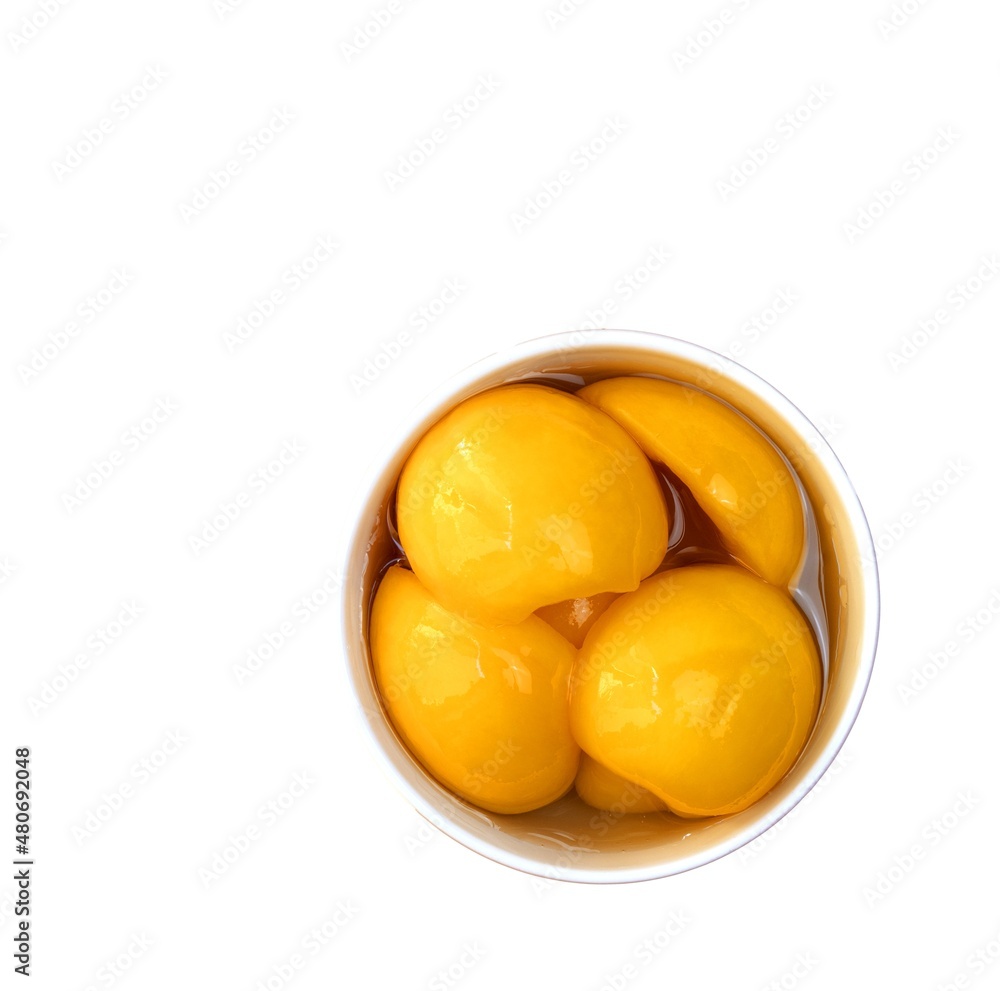 Delicious peaches in syrup in a bowl on white background copia Delicious peaches in syrup in a bowl on white background copia