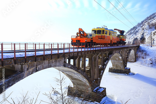 Quadro su tela Circum-Baikal railway train on the bridge, travel across Russia Siberia