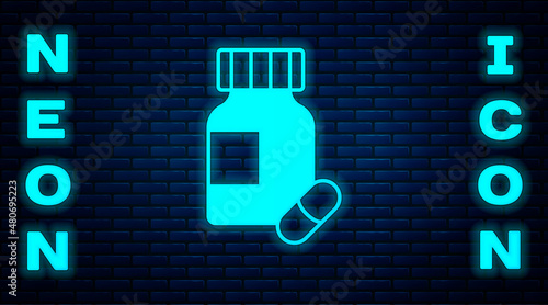 Glowing neon Sedative pills icon isolated on brick wall background. Vector