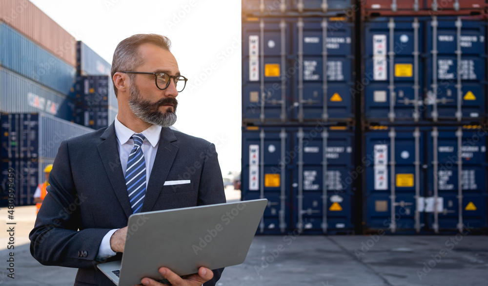 custom made wallpaper toronto digitalThe warehouse manager or business man are using laptops view oranalytics warehouse information. He used technology to help with warehouse management at shipyards in transportation logistic concept